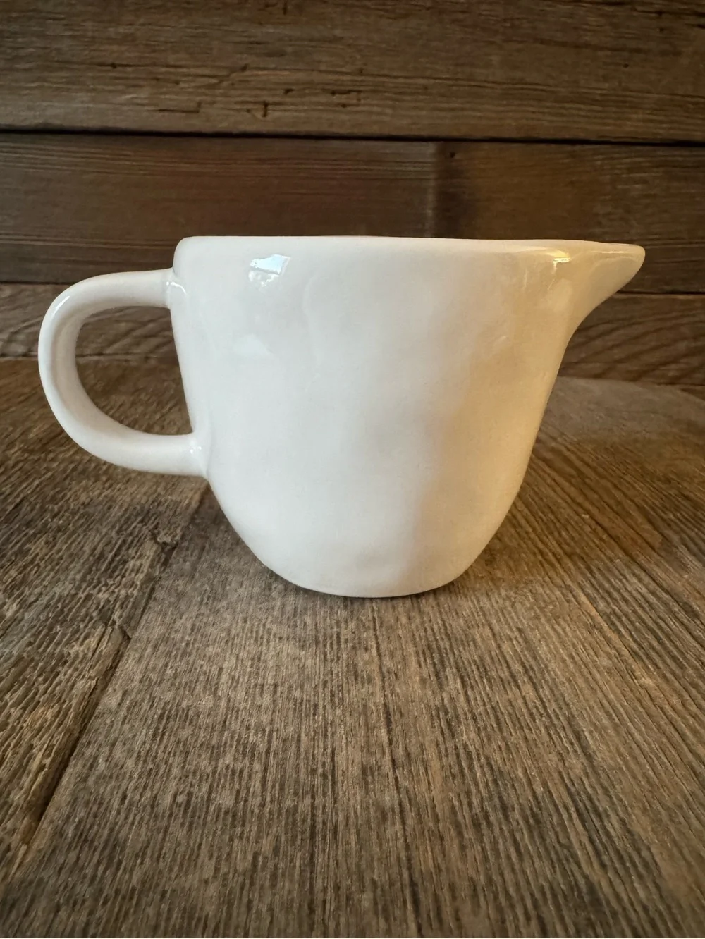 Rae Dunn “Pour.” Ceramic creamer with Cow Graphic